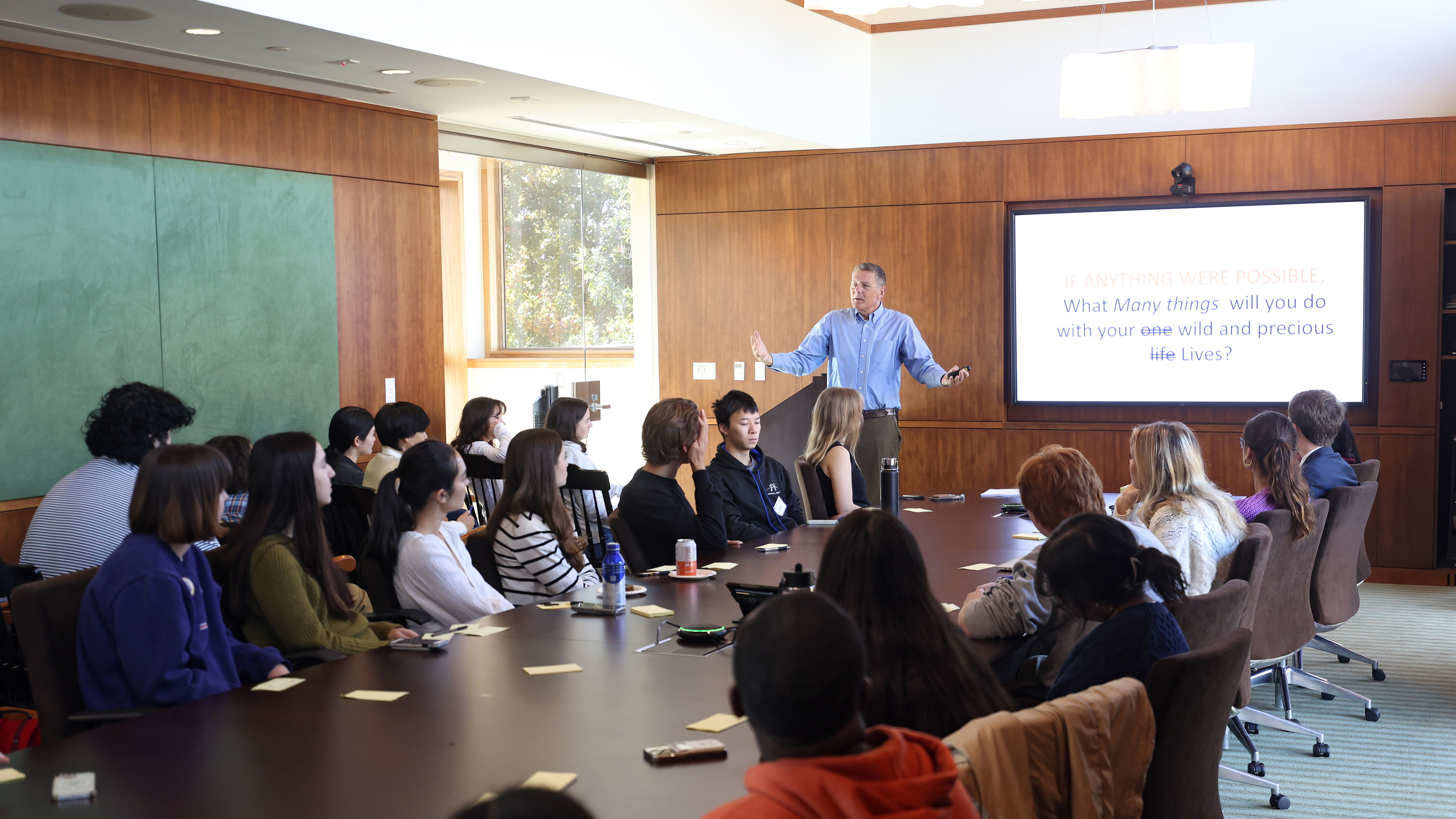 Scholars in discussion in Blue Board Room